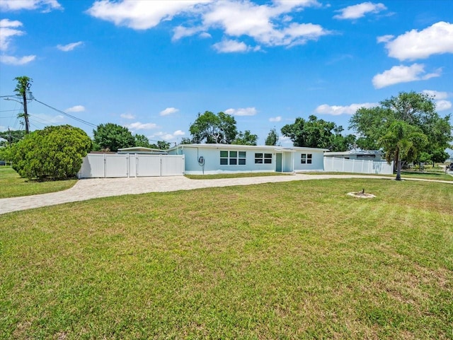 4005 W Coachman Ave, Tampa, FL 33611 - view of front of house with a gate and decorative driveway