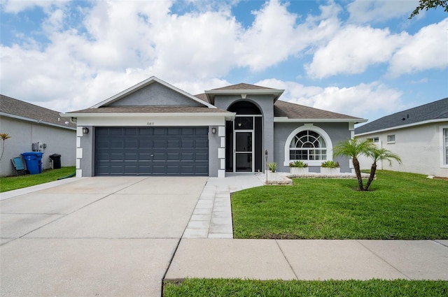 10811 Lakeside Vista Dr, Riverview, FL 33569 - ranch-style home featuring stucco siding, concrete driveway, a garage, and a front yard