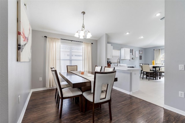 10811 Lakeside Vista Dr, Riverview, FL 33569 - dining room with a chandelier, wood finished floors, baseboards, and recessed lighting