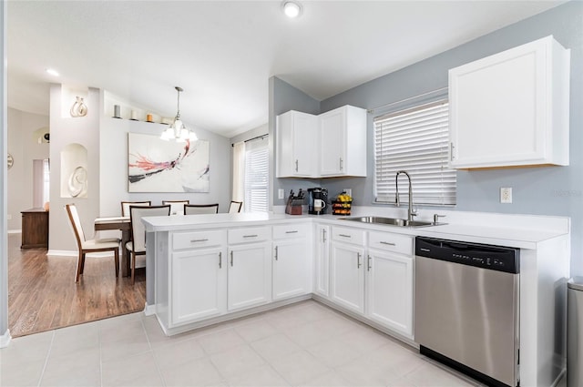 10811 Lakeside Vista Dr, Riverview, FL 33569 - kitchen featuring dishwasher, a sink, a chandelier, vaulted ceiling, and light countertops