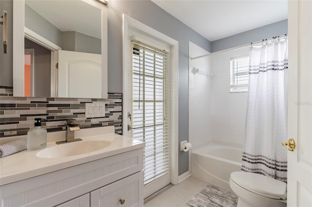 10811 Lakeside Vista Dr, Riverview, FL 33569 - full bathroom featuring toilet, vanity, shower / bathtub combination with curtain, tile patterned floors, and decorative backsplash