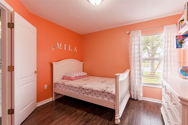 10811 Lakeside Vista Dr, Riverview, FL 33569 - bedroom with dark wood-style floors and baseboards