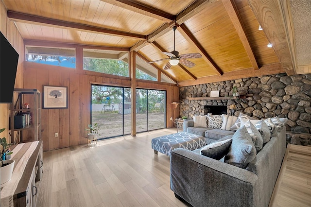 525 Gornto Lake Rd, Brandon, FL 33510 - living room with wooden ceiling, light wood-type flooring, a ceiling fan, wooden walls, and a fireplace