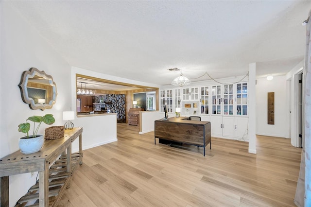 525 Gornto Lake Rd, Brandon, FL 33510 - living area featuring a chandelier, light wood-style floors, and baseboards