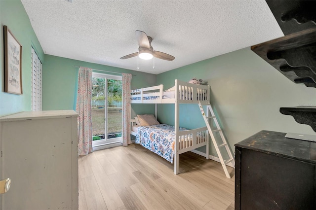 525 Gornto Lake Rd, Brandon, FL 33510 - bedroom with wood finished floors, a textured ceiling, and ceiling fan