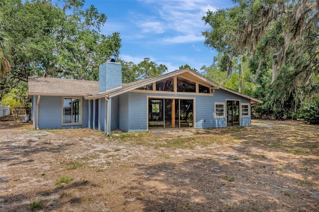 525 Gornto Lake Rd, Brandon, FL 33510 - back of property featuring a chimney and central AC unit