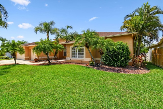 13028 Prestwick Dr, Riverview, FL 33579 - view of front of home with an attached garage, stucco siding, and driveway