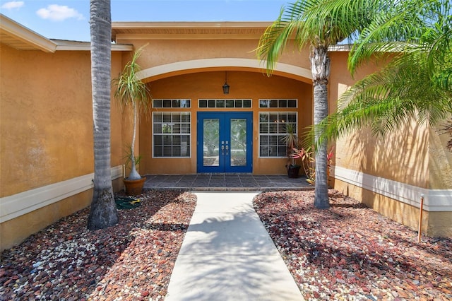 13028 Prestwick Dr, Riverview, FL 33579 - property entrance with french doors and stucco siding
