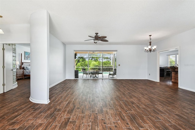 13028 Prestwick Dr, Riverview, FL 33579 - unfurnished living room with wood finished floors, a ceiling fan, baseboards, and a chandelier