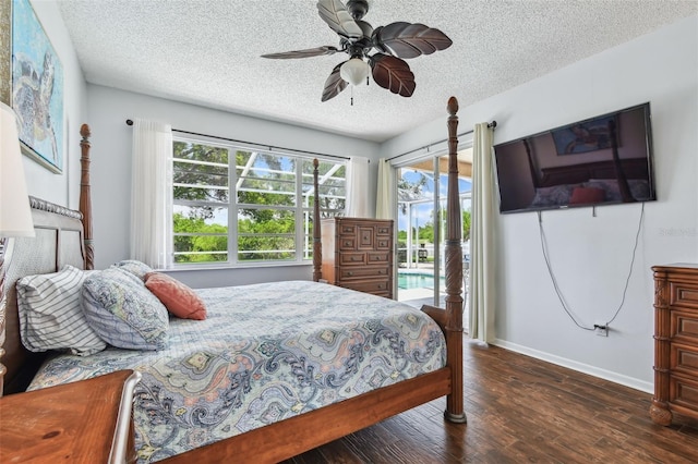 13028 Prestwick Dr, Riverview, FL 33579 - bedroom featuring access to outside, wood finished floors, a textured ceiling, multiple windows, and baseboards