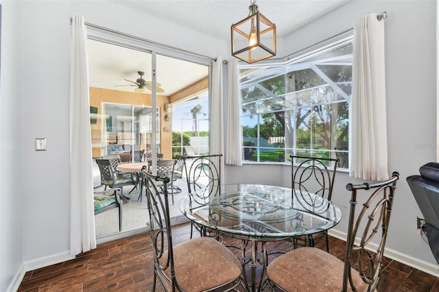 13028 Prestwick Dr, Riverview, FL 33579 - dining space featuring dark wood-type flooring, ceiling fan, and baseboards