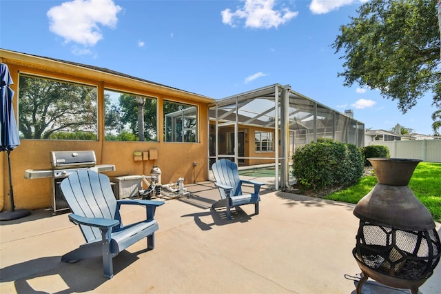 13028 Prestwick Dr, Riverview, FL 33579 - view of patio with glass enclosure and grilling area