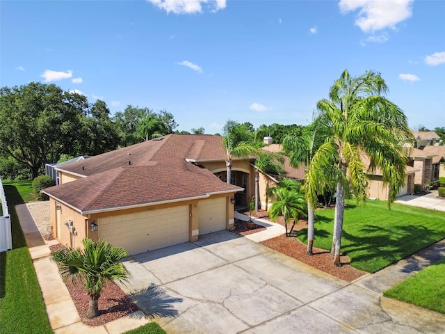 13028 Prestwick Dr, Riverview, FL 33579 - view of front of property featuring stucco siding, concrete driveway, a garage, a front lawn, and roof with shingles