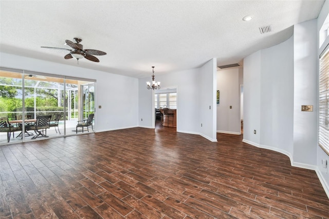 13028 Prestwick Dr, Riverview, FL 33579 - unfurnished living room featuring a textured ceiling, dark wood-style floors, a chandelier, ceiling fan, and baseboards