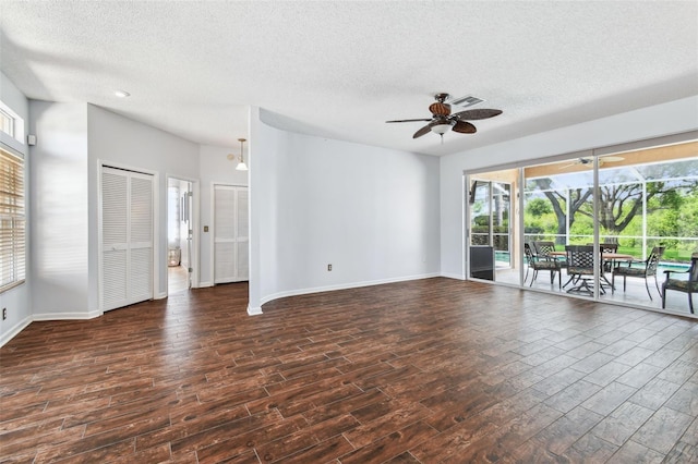 13028 Prestwick Dr, Riverview, FL 33579 - spare room featuring a textured ceiling, a ceiling fan, wood finished floors, healthy amount of natural light, and baseboards