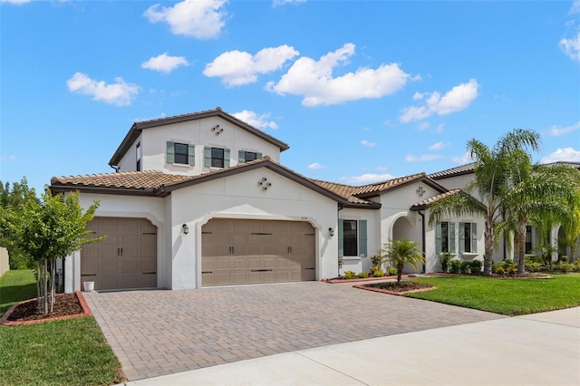 6154 Marsh Trail Dr, Odessa, FL 33556 - mediterranean / spanish house featuring stucco siding, an attached garage, and driveway