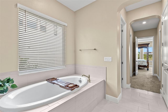 6154 Marsh Trail Dr, Odessa, FL 33556 - ensuite bathroom featuring a bath and baseboards