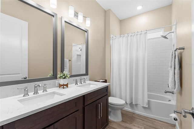 6154 Marsh Trail Dr, Odessa, FL 33556 - full bathroom with toilet, double vanity, shower / tub combo with curtain, and wood finished floors