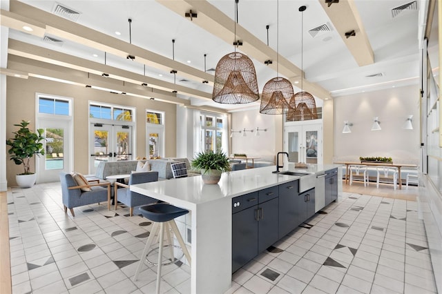6154 Marsh Trail Dr, Odessa, FL 33556 - kitchen with french doors, open floor plan, a towering ceiling, a sink, and light tile patterned floors