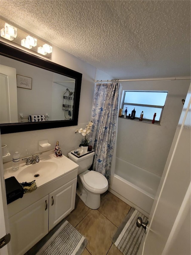 full bathroom with a textured ceiling, toilet, tile patterned floors, vanity, and shower / bathtub combination with curtain