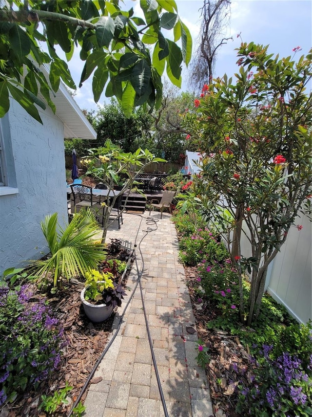 fenced backyard with a patio area