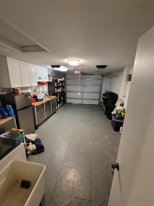 garage featuring freestanding refrigerator