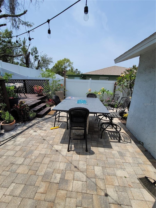 6318 Ridge Crest Dr, Port Richey, FL 34668 - fenced backyard with outdoor dining space and a patio area