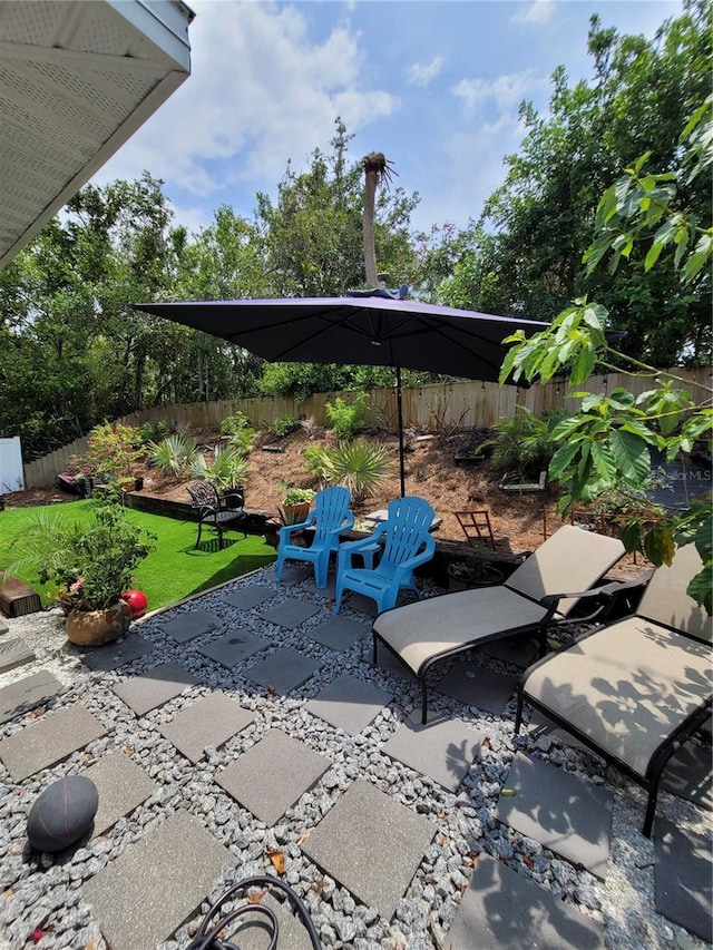6318 Ridge Crest Dr, Port Richey, FL 34668 - fenced backyard featuring a patio area