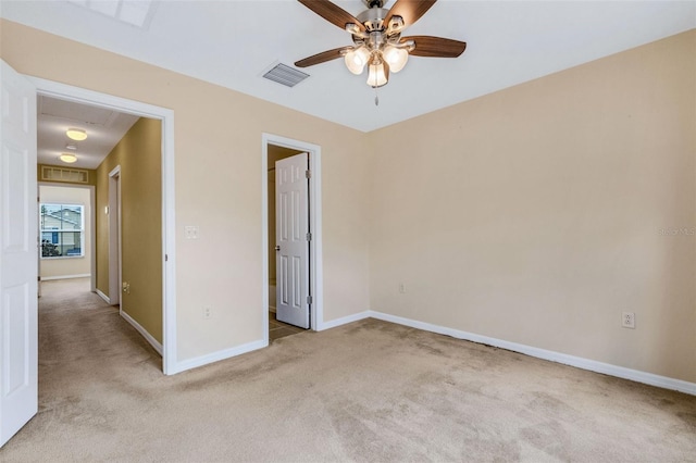 9013 White Sage Loop, Lakewood Ranch, FL 34202 - unfurnished bedroom with light colored carpet, baseboards, attic access, and ceiling fan