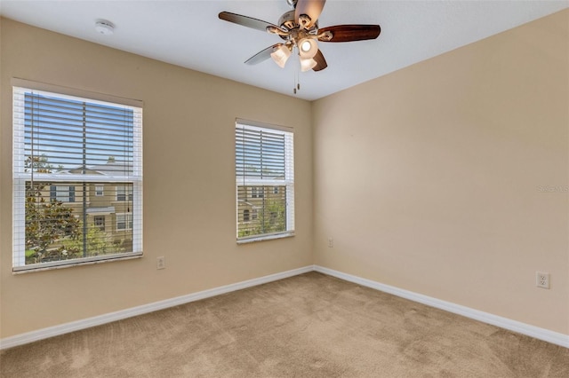 9013 White Sage Loop, Lakewood Ranch, FL 34202 - spare room featuring light carpet, baseboards, ceiling fan, and a smoke detector