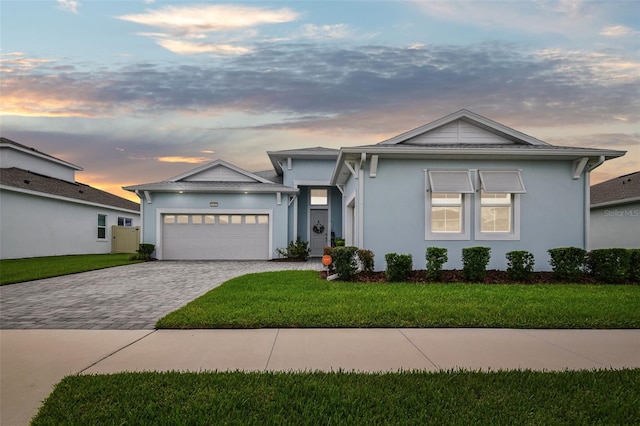 8192 Ivy Stark Blvd, Wesley Chapel, FL 33545 - single story home with an attached garage, decorative driveway, a front yard, and stucco siding