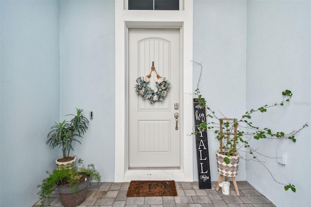 8192 Ivy Stark Blvd, Wesley Chapel, FL 33545 - doorway to property featuring stucco siding
