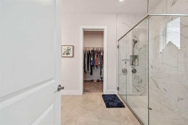 8192 Ivy Stark Blvd, Wesley Chapel, FL 33545 - full bath featuring a marble finish shower, baseboards, and a walk in closet