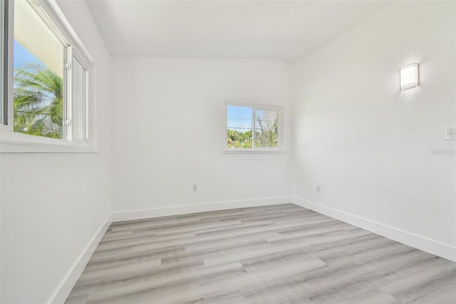 695 Sunset Dr, Tarpon Springs, FL 34689 - unfurnished room featuring baseboards and light wood-style floors