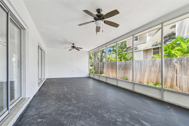 695 Sunset Dr, Tarpon Springs, FL 34689 - unfurnished sunroom featuring a ceiling fan