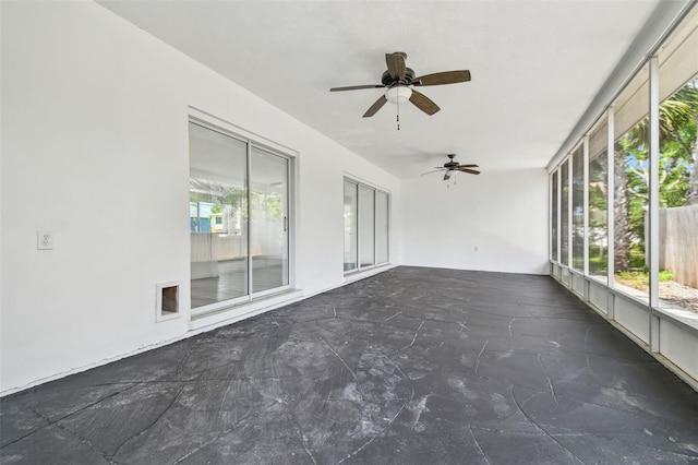 695 Sunset Dr, Tarpon Springs, FL 34689 - unfurnished sunroom featuring a ceiling fan