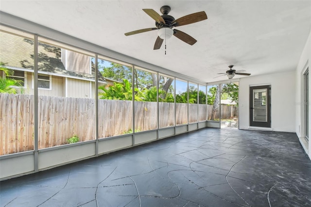 695 Sunset Dr, Tarpon Springs, FL 34689 - unfurnished sunroom with a ceiling fan