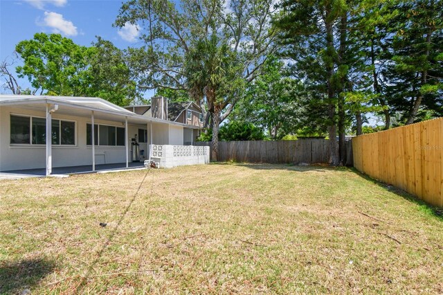 695 Sunset Dr, Tarpon Springs, FL 34689 - view of yard featuring a patio