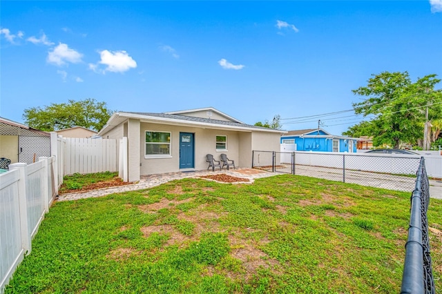 3927 Spence Ave, Tampa, FL 33614 - rear view of house featuring stucco siding