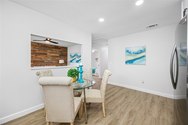 3927 Spence Ave, Tampa, FL 33614 - dining room with light wood-type flooring, baseboards, and recessed lighting