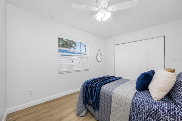 3927 Spence Ave, Tampa, FL 33614 - bedroom featuring light wood finished floors, baseboards, a closet, and a ceiling fan