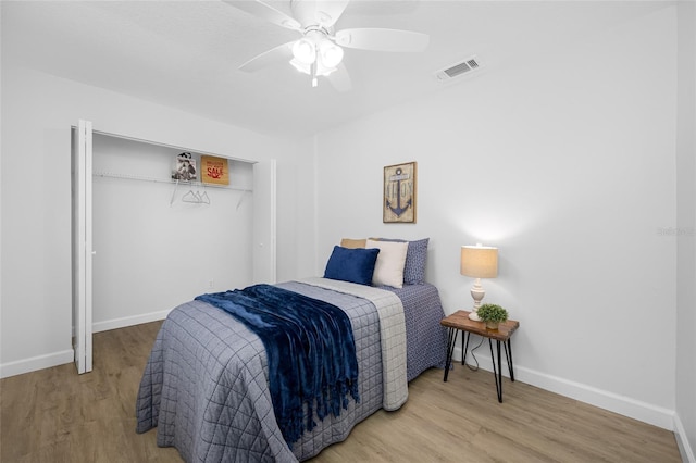 3927 Spence Ave, Tampa, FL 33614 - bedroom featuring baseboards, wood finished floors, and a closet