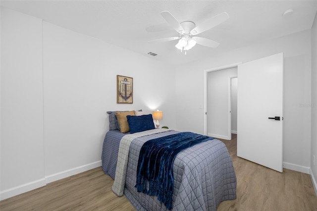 3927 Spence Ave, Tampa, FL 33614 - bedroom featuring baseboards, wood finished floors, and a ceiling fan