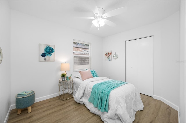 3927 Spence Ave, Tampa, FL 33614 - bedroom with light wood-type flooring, baseboards, a closet, and ceiling fan