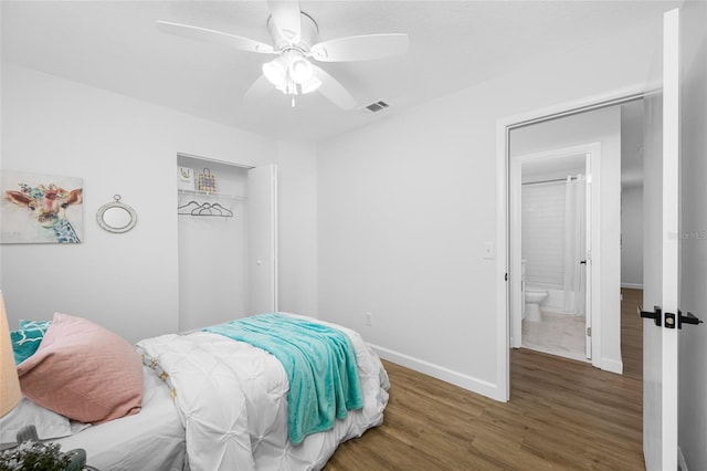 3927 Spence Ave, Tampa, FL 33614 - bedroom with wood finished floors, baseboards, a closet, and ceiling fan