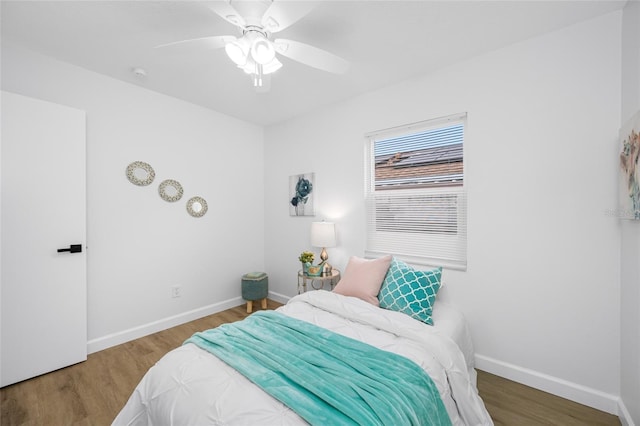 3927 Spence Ave, Tampa, FL 33614 - bedroom featuring wood finished floors, baseboards, and a ceiling fan