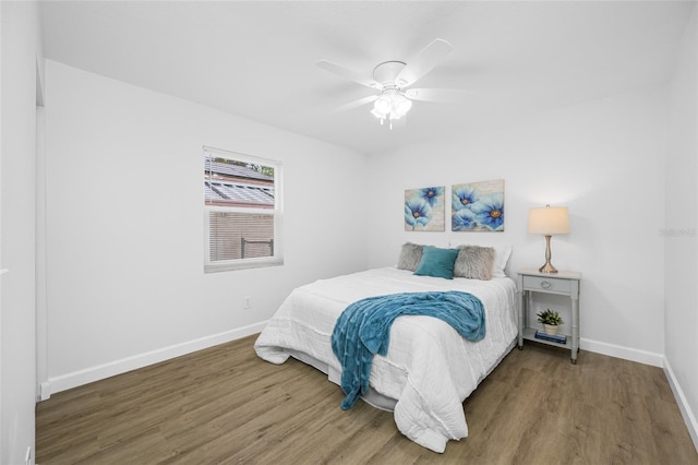 3927 Spence Ave, Tampa, FL 33614 - bedroom featuring wood finished floors, baseboards, and a ceiling fan