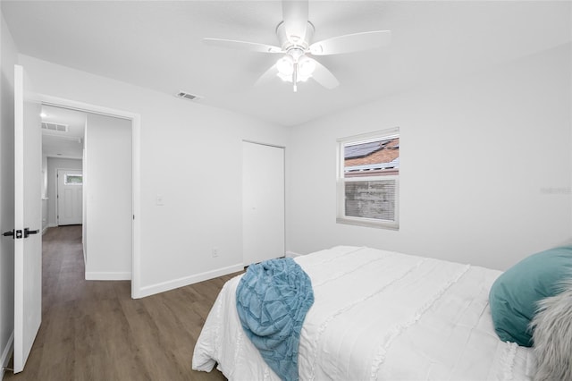 3927 Spence Ave, Tampa, FL 33614 - bedroom with wood finished floors, baseboards, a closet, and a ceiling fan
