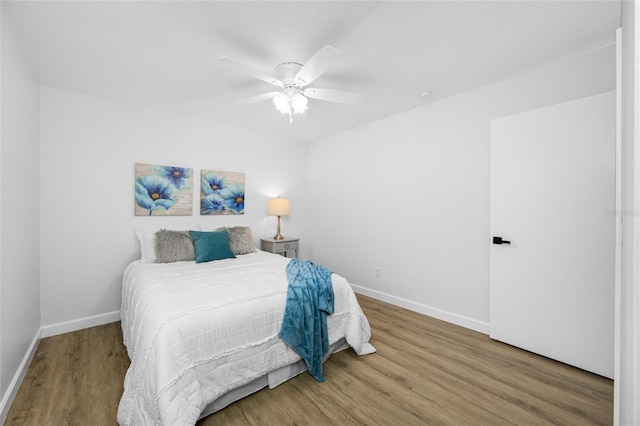 3927 Spence Ave, Tampa, FL 33614 - bedroom featuring baseboards, wood finished floors, and ceiling fan