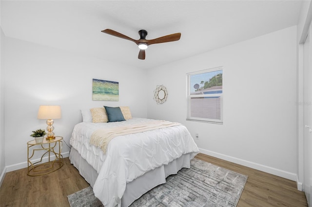 3927 Spence Ave, Tampa, FL 33614 - bedroom featuring baseboards, wood finished floors, and a ceiling fan
